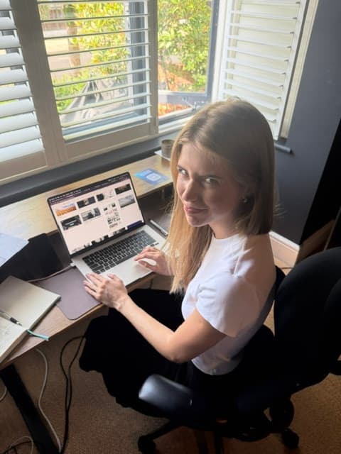 Working at a laptop by the window
