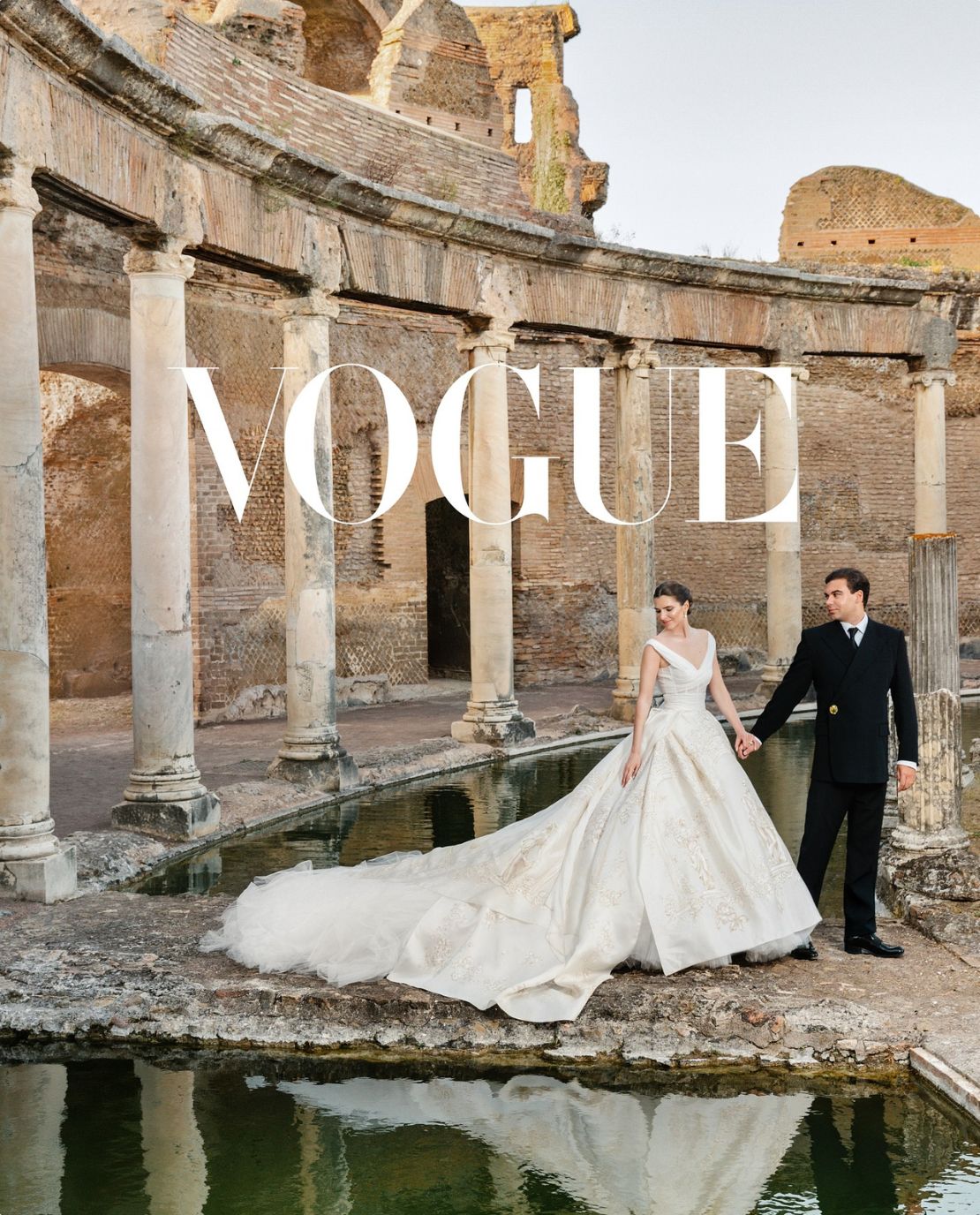 Vogue-featured wedding planned by the Darcy team: couple beside the water in ancient ruins